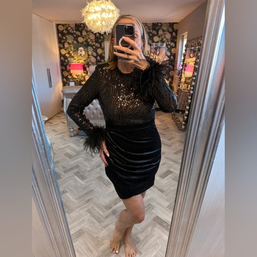 Stunning Lavish Alice fully lined boned dress with feather cuffs